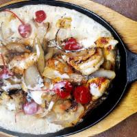 Pollo Monterrey · Grilled seasoned chicken topped with grilled onions, shrimp, cherries, melted cheese, and a ...
