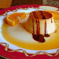Flan · The most delicious dessert! Custard with a layer of soft caramel on top topped with our butt...