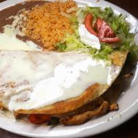 Fajita Quesadilla · A flour tortilla stuffed with grilled steak or chicken stir-fried with onions, tomatoes and ...