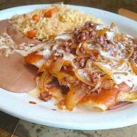 Enchiladas Toluca · Three enchiladas: beef tips, chicken and cheese smothered with chorizo and grilled onions. T...