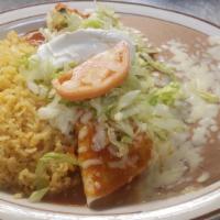 Burrito Mi Tradicion · New! Ground beef or chicken burrito topped with special burrito salsa, cheese, and sour crea...