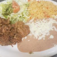 Carnitas · Delicious seasoned fried pork tips, served with rice, refried beans, salad, pico de gallo, a...