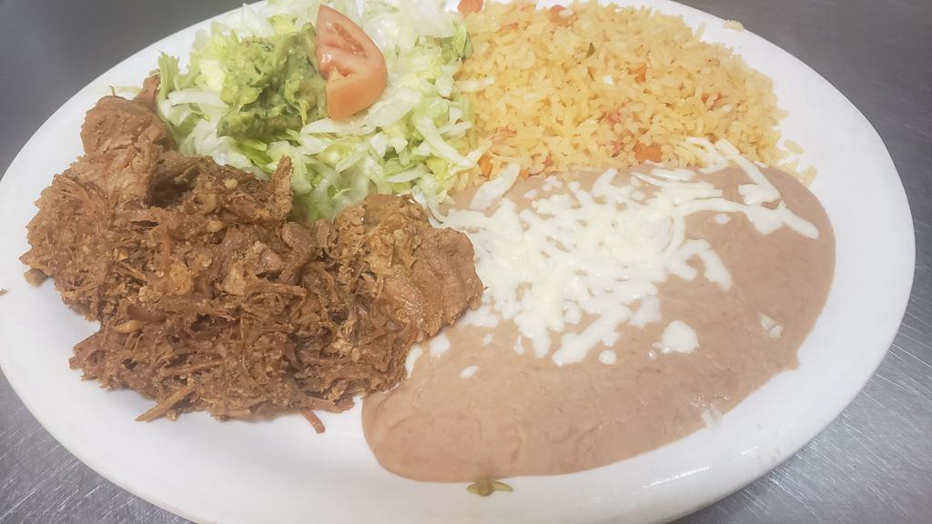 Carnitas · Delicious seasoned fried pork tips, served with rice, refried beans, salad, pico de gallo, and tortillas.
