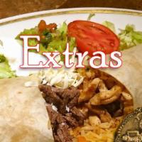 Super Burrito Grilled · This is one big burrito. Choose between steak or chicken filled with your choice of black be...