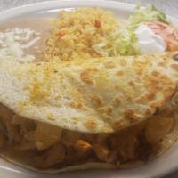 Quesadilla Hawaiian · A unique tropical treat! Filled with grilled chicken, cheese, chorizo, and topped with grill...