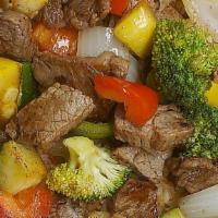 Steak And Rice · Grilled steak, zucchini, squash, broccoli, mushrooms, green and red bell pepper, onions on t...