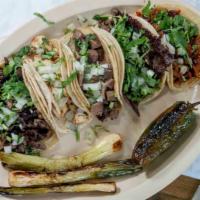 Comales Taco Tray · Requires 24-hour notice to order. Twenty tacos. Choice of meats and a pitcher of soda. Perfe...