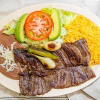 Carne Asada · Grilled skirt steak served with with cactus, grilled onions, and peppers. Served with rice a...