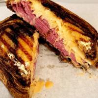 Reuben Sandwich · Extra large corn beef with thousands island dressing, pickles, onions, Swiss cheese and saue...