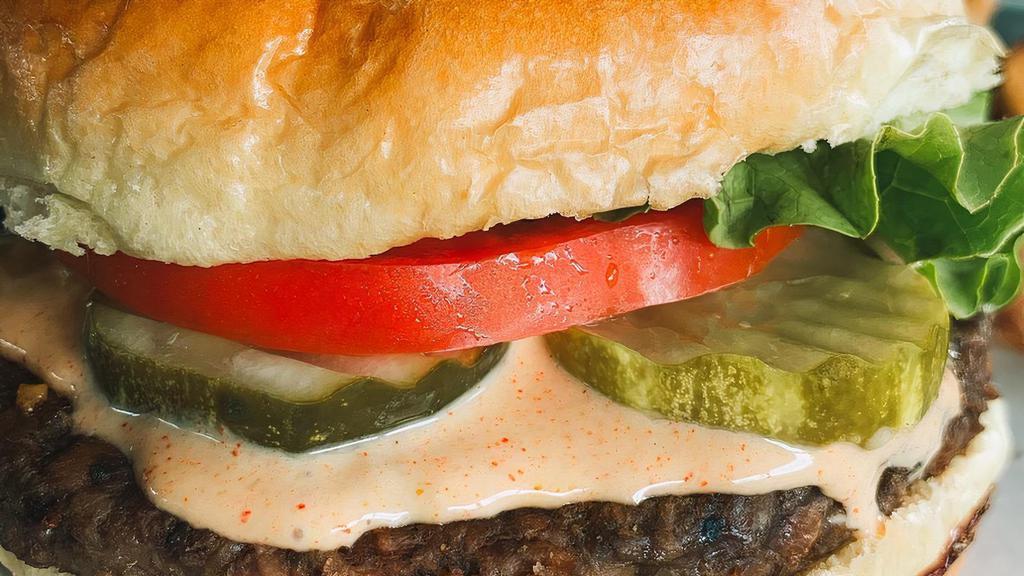 Violet'S Vegan Burger · A hand formed vegan patty topped with melted vegan cheddar, lettuce, tomato, red onion, pickles, and our special vegan burger sauce on a brioche style bun