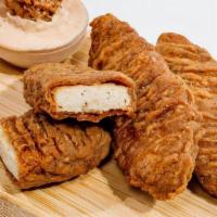 Jumbo Chick'N Tenders. · Crispy plant based jumbo southern fried Chick’n tenders with your choice of sauce. Served wi...