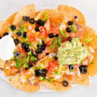 Ruby'S Nachos · Includes beans, peppers, onion, tomato, olives, cheddar cheese, mozzarella cheese, guacamole...