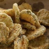 Pickle Chips. · Breaded pickle slices, house ranch and chipotle ranch