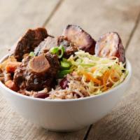 Braised Oxtail · Braised oxtail, served in a bowl only with coconut rice and beans, sweet-fried plantains and...