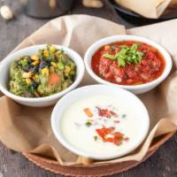 Chip & Dip Trio · All of your favorites together: salsa, queso blanco, and guacamole served with fresh tortill...
