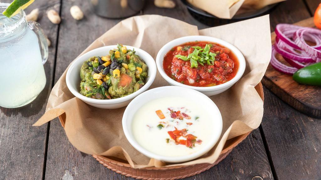 Chip & Dip Trio · All of your favorites together: salsa, queso blanco, and guacamole served with fresh tortilla chips.