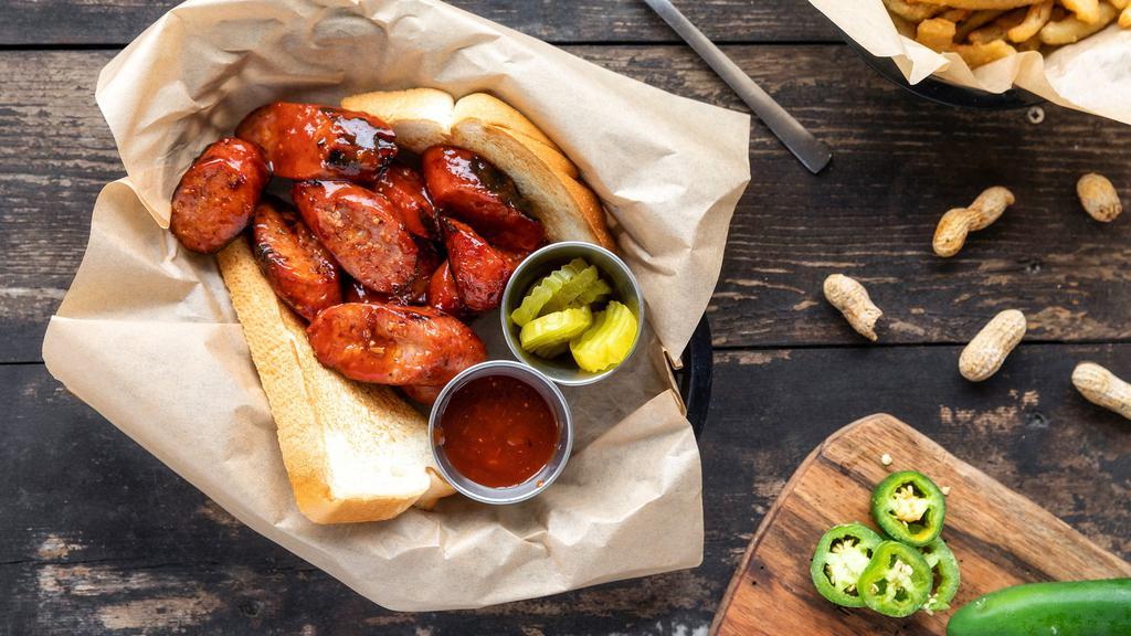 Texas Sausage · ½ lb. link of our grilled jalapeño infused sausage served with Texas toast, pickles & BBQ sauce.