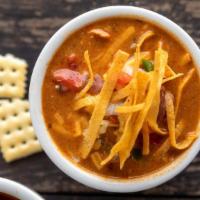 Chicken Tortilla Soup · Potato soup topped with cheese, bacon and green onions.