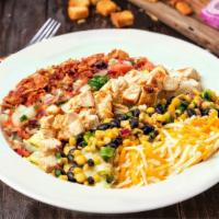 Southwest Cobb Salad · Enjoy our hickory grilled chicken, homemade corn & black bean salsa, shredded cheese, bacon ...