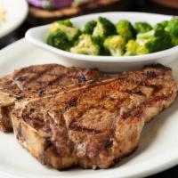 22 Oz. T-Bone* · A full-flavored strip on one side and a fork-tender filet on the other.