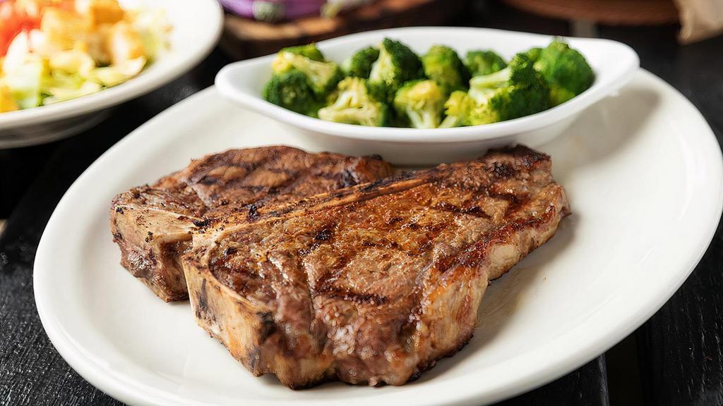 22 Oz. T-Bone* · A full-flavored strip on one side and a fork-tender filet on the other.