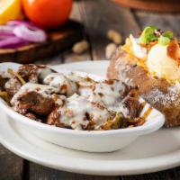 Southwest Steak Tips* · Tender cuts of steak with onions and peppers topped with melted cheese.