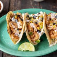 Shrimp Tacos · 3 Shrimp Tacos served with coleslaw, corn and black bean salsa and a zesty chipotle bacon ra...