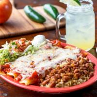 Santa Fe Enchiladas · Your choice of three ground beef or shredded chicken filled corn tortillas topped with our s...