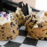 Cookie Dough Scoop - Build Your Own · our homemade cookie dough topped with one frosting and one topping of your choice.