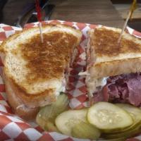 Reuben · Corned beef, sauerkraut and melted swiss cheese on an onion roll or rye.