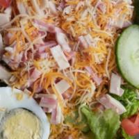 Chef Salad · Ham, turkey, hard-boiled egg, lettuce, tomato, cucumbers, swiss and American cheese.