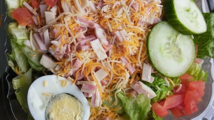 Chef Salad · Ham, turkey, hard-boiled egg, lettuce, tomato, cucumbers, swiss and American cheese.