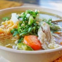Caldo De Pollo · Hearty soup made with chicken, cabbage, carrots, and zuchini.. On the side: chopped onions, ...