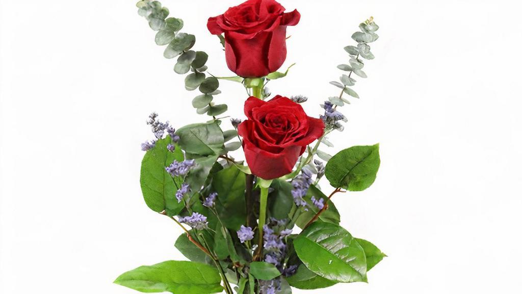 Double Rose In A Budvase · two roses in a budvase with fresh greens and a filler. colors may vary