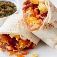 Breakfast Burrito · Chorizo, onions, pepper jack cheese, tomatoes, flour tortilla & hash browns. Served with toa...