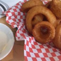 Golden Onion Rings · Beer battered crispy onion rings, served with Buttermilk ranch dip.