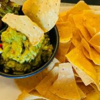 Chips And Guac · Fresh crispy prepared corn tortilla chips and our homemade fresh guacamole .