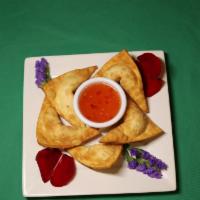 Crab Rangoon · Deep-fried wonton skin with cream cheese and crabmeat. Served with sweet & sour sauce.