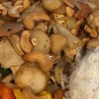 Cashew Chicken · Stir-fried chicken with cashew nuts, water chestnut, onions, and hot peppers in a special ho...