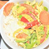 Green Curry · An aromatic green curry with coconut milk ,snow peas, bamboo shoot, bell peppers and fresh s...