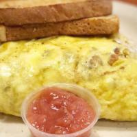 Everything Omelet · 3 egg omelet stuffed with fresh veggies, hash browns, diced ham, Italian sausage, sausage, b...