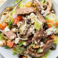 Steak Salad · Mixed greens, feta cheese, tomatoes, onions, mushrooms, black olives, and steak