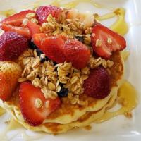 Gooey Granola Pancakes · Comes with granola, fresh berries and honey.
