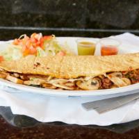 Nopales · Giant Handmade quesadilla filled with cheese and cactus, served with a side of lettuce and t...