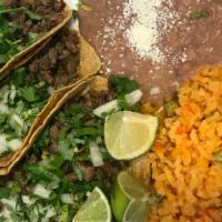 3 Taco Dinner · Served with rice and beans. 
Choose from steak, chicken, pastor, or chorizo. Tacos topped wi...
