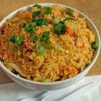Chicken Fried Rice · Chicken stir-fried with vegetables, rice and scrambled eggs.