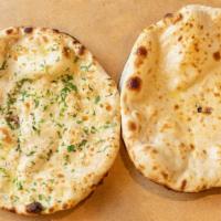 Butter Naan · Plain bread baked in a clay oven and coated with fresh Butter.
