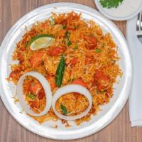 Spl Chicken  Biryani · Boneless Chicken cooked in basmati rice with special herbs and spices.