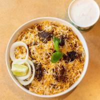 Hyderabadi Goat Dum Biryani · Goat cooked in basmati rice with special herbs and spices.