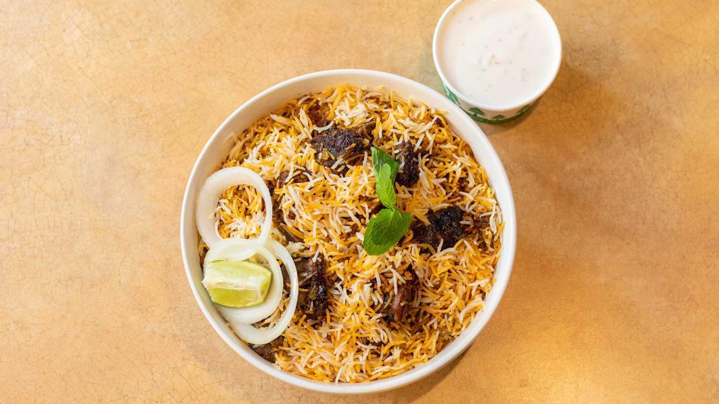Hyderabadi Goat Dum Biryani · Goat cooked in basmati rice with special herbs and spices.